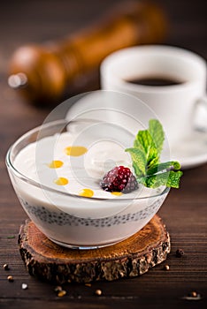 Chia Pudding Dessert with raspberries, dessert with chia seeds with raspberry on rusic background