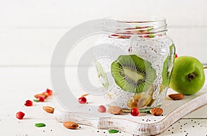 Chia pudding with fresh berries in glass jar.