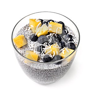 Chia Pudding Isolated in Glass with Blueberries Mango and Shredded Coconut