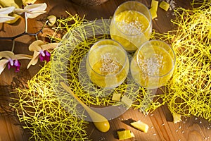 Chia pudding or smoothie with mango puree, coconut milc and coconut chips