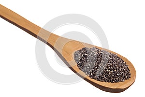 Chia Seed. Grains over wooden spoon, isolated white background.