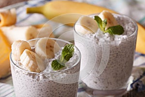 Chia seed pudding with fresh banana and a glass of macro
