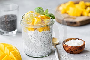 Chia seed pudding with mango cubes and coconut