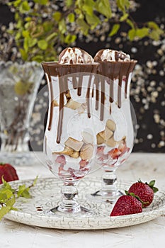 Chia seed pudding with strawberry and biscuits in a glass