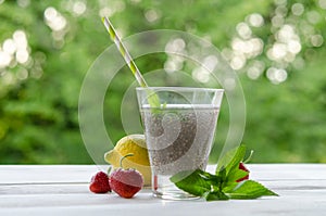 Chia seeds drink with water in transparent glass