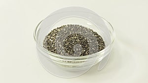 Chia seeds in a glass bawl isolated against a white background