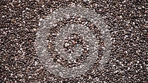 Chia seeds on rotation background. Healthy food, super seeds texture. Food ingredient background. Top view, healthy