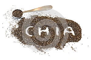 Chia seeds scattered on a white background with the word chia spelled out, and a metal teaspoon