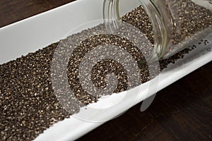 Chia seeds spilling out of container