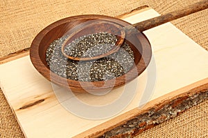 Chia Seeds With Spoon On Wooden Plank