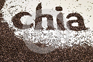 Chia word made from chia seeds Salvia hispanica on white background.