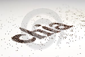 Chia word made from chia seeds Salvia hispanica on white background.