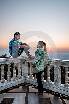 Chiang Mai Thailand, couple watch sunrise from the mountain , Wat Phra That Doi Suthep is famous visiting place and