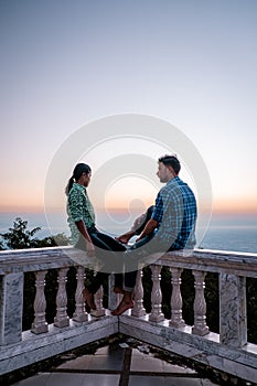 Chiang Mai Thailand, couple watch sunrise from the mountain , Wat Phra That Doi Suthep is famous visiting place and