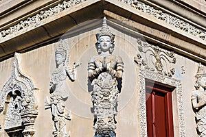 Chiang Mai, Thailand - December, 19, 2022 : Thai white angel statue stucco in Wat Phra Singh , temple in Chiang Mai, Thailand