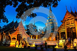 Chiang Mai, Thailand. Illuminated temples of Phra Singh photo