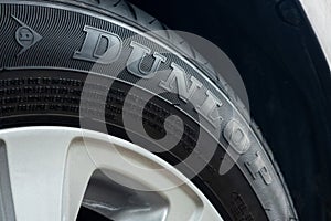 Dunlop tire installed on wheel car photo