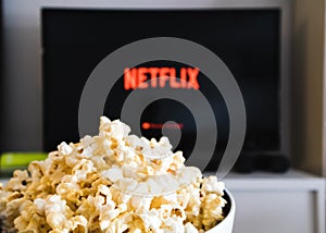 CHIANGMAI, THAILAND - JULY 5, 2019- Netflix logo on Smart TV and Popcorn bowl