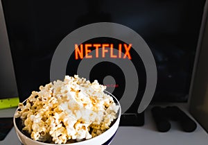 CHIANGMAI, THAILAND - JULY 7, 2019- Popcorn bowl and Netflix logo on Smart TV