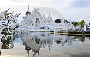 Wat Rong Khun White Temple is one of most favorite landmarks tourists visit in Thailand, built with modern contemporary unconven