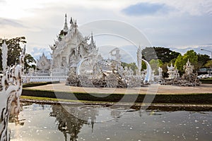 Wat Rong Khun White Temple is one of most favorite landmarks tourists visit in Thailand, built with modern contemporary unconven