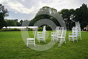 Chiavari chairs on grass.