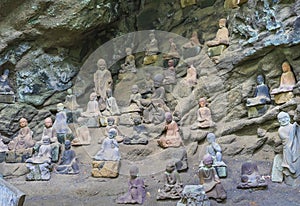 Buddhist statues of arhat monks in a cavity of Gomakutsu in Mount Nokogiri.