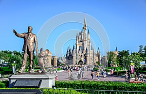 CHIBA, JAPAN: Walt Disney statue with view of Cinderella Castle in the background, Tokyo Disneyland