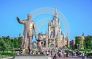 CHIBA, JAPAN: Walt Disney statue with view of Cinderella Castle in the background, Tokyo Disneyland