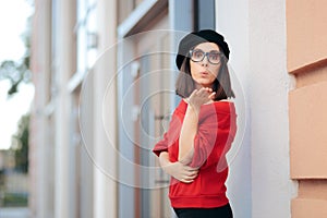 Chic Girlfriend Wearing a Beret Blowing a Kiss