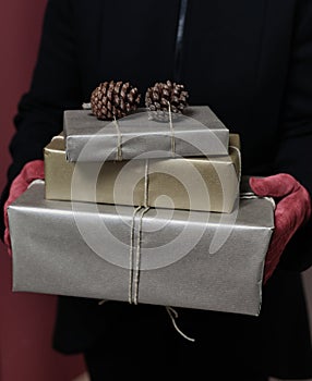 Chic young woman Woman holding her stylish Christmas present