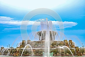 Chicago Buckingham fountain in Grant Park in the morning with cloud and blue sky.