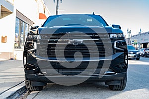 Chicago City, USA - April 26, 2023: 2023 Chevrolet Tahoe SUV black car front view parked