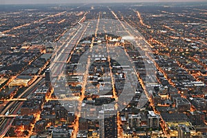 Chicago cityscape during sunset at night. Taken from above at Skydeck Willis Tower. Railroad in sight