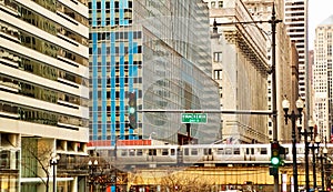 Chicago elevated 'el' train at rush hour on Wacker & LaSalle street corner in downtown Loop. photo