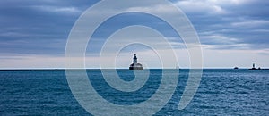 Chicago harbor light in the afternoon, blue lake water and sky background, banner