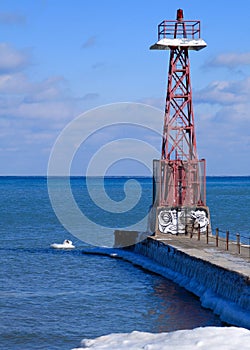 Chicago lighthouse on north side, jutting into a frozen Lake Michigan