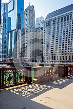 Chicago Loop cityscape and shadow patterns on bridge during sunny summer morning