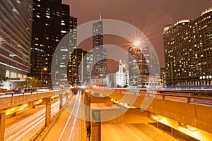 Chicago multi-level road system leads into city at night