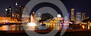 Chicago skyline and Buckingham Fountain at night.