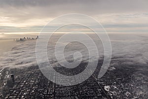 Chicago skyline popping up out of clouds in the winter