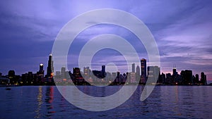 Chicago skyline reflected on the lake at sunset time lapse