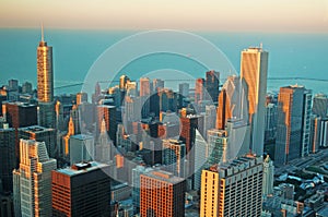 Chicago: skyline at sunset seen through the glass of the Willis Tower observation deck on September 22, 2014