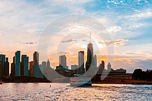 Chicago skyline viewed from the pier on Lake Michigan with sunset sky in the background