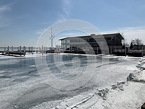 Chicago is about to thaw the lake, white ice blue sky