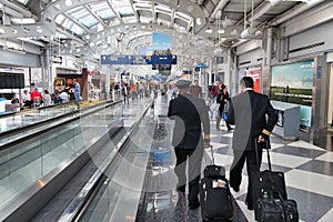 CHICAGO, USA - APRIL 1, 2014: Pilots walk to gate at Chicago O 'Hare International Airport in USA. It was the 5th busiest airport