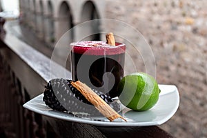 Chicha morada. Peruvian drink, decorated with lime