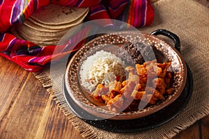Chicharron en salsa roja mexican food photo