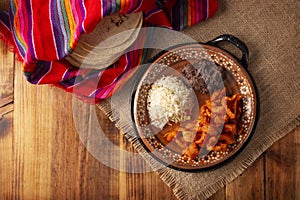 Chicharron en salsa roja mexican food topview photo