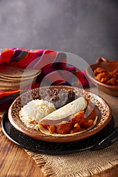 Chicharron en salsa roja Tacos mexican food photo